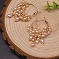 Handmade hoop earrings with pink freshwater pearls and golden bead wire wrapping detail - Pink Pearl Set Hoop Earrings
