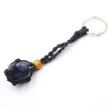 Lapis lazuli stone keychain featuring black woven net pouch and yellow wooden bead - Blue Vein Stone + Black Mesh Keychain