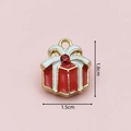 Macro shot of a red and gold enamel Christmas gift box charm with gemstone details - 2842 Rhinestone Gift Box