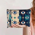 Detail showing the Evil Eye printed canvas makeup bag with secure zipper closure - Dark Blue Gold Evil Eye (jiayingpbb0426)