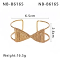 Detail shot of golden irregular wide cuff bangle showing leaf texture and bow shape wire - Wrapped Bow Style (NB-B6165)
