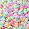 Macro shot of colorful resin candy stars and heart beads for DIY nail art and jewelry - Heart Speech Bubble