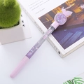 Sparkling purple glitter liquid quicksand pen with butterfly topper on a white book - Butterfly Purple