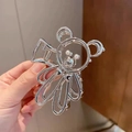 Dettaglio ravvicinato di una pinza per capelli a forma di orsetto in metallo argento - Lega / Orso d'argento