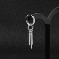 Macro shot of polished stainless steel hoop earrings with three vertical pillar charms - Silver Round Bar Hoop (Single)