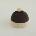 Detail of ribbed knit brown and beige kids docker hat with fluffy pompom decoration - 50-52cm (2-4 Years) / Brown and Cream
