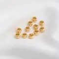 Makroaufnahme von 14K goldgefüllten Radperlen mit poliertem Spiegelglanz für DIY-Schmuck - AD 5,5mm Dicke 3,2mm Loch 3,2mm