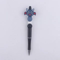Detail view of cartoon bat silicone beads on a black plastic beaded pen for DIY crafts - Blue Bat