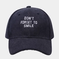Navy corduroy baseball cap with 'Don't Forget To Smile' white embroidery on a gray background - Adjustable / Navy Blue