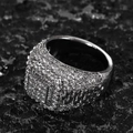 Macro shot of men's iced out hip hop ring with cubic zirconia on black volcanic stone - US-7 / White Gold Color-White Zirconia