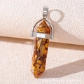 Macro shot of hexagonal crystal pendant with silver cap and gold flake resin details - Resin Orange Stone