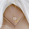 Golden flower necklace with pearl center and crystals in a beige jewelry box - Flower with Pearl Center Style (C237)