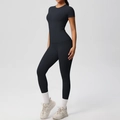 Detail of black slim fit yoga set featuring high waist leggings and short sleeve top - S / Black