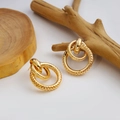 Golden multi-layered interlaced hoop earrings with polished and textured finish details - Textured Nested Hoops