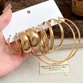 Close-up of gold chunky hoop earrings set with vintage texture on knitted background - 12# Silver Needle - Gold (10-piece Set)