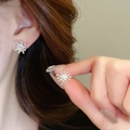 Detail view of silver firework stud earrings showing 3D metallic texture and fit - 15# Silver Radiative Ball Granule Style (HE29891)