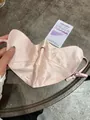 Detail of soft pink silk sun protection mask with adjustable ear loops and smooth texture - Pink Gold
