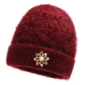 Women's burgundy knit hat with plush mohair texture and elegant gold flower brooch - Red