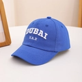 Detailed view of white DUBAI U.A.E 3D embroidery on royal blue cotton baseball cap - 54cm (3-8 Years) / Blue