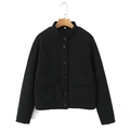 Close-up of black tweed jacket featuring textured weave and circular button details - S / Black