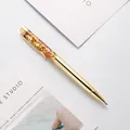 Elegante penna a sfera con scaglie d'oro galleggianti e finitura in metallo dorato - Oro