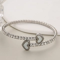 Zilveren roestvrijstalen open armband met zirkonia kristallen en witte hartjes - Zilver