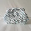 Macro detail of hand-knitted cloud bag showing blue and white cotton fabric texture - Blue & White