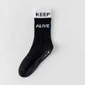 Chaussette de yoga noire antidérapante avec bord blanc et inscription KEEP ALIVE - Noir