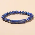 Deep blue natural lapis lazuli beaded bracelet with silver spacers on warm background - 1A Natural Lapis Lazuli