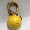 Durable yellow elastic rubber dog ball with textured grooves and a colorful woven tug rope - 9cm Flat Rope Ball