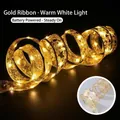 Cinta de Navidad dorada con luces LED, estrellas y suave brillo blanco cálido - 4m 40 LEDs + Caja de Batería / Cinta Dorada Luz Blanca Cálida
