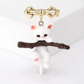 Cartoon alloy cat on branch brooch with golden bow and white feline pendant - White