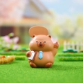 Cute brown capybara figurine with blue tie and sign board on green grass turf - 3087 Office Capybara