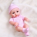30cm newborn doll in pink hooded pajamas lying on a soft white plush blanket - Pink Plush Romper Set
