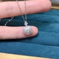 Delicate silver heart-shaped diamond pendant necklace with halo setting on a blue box - Full Diamond Heart-shaped Necklace Xl-123