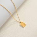 Macro view of 18K gold plated square pendant with embossed sun and moon star details - Gold-Sun Moon Star Embossed Square Pendant