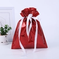 Macro detail of red laser drawstring gift bag with white ribbon in a home setting - Laser Small Red 24*32