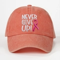 Detailed embroidery of 'NEVER GIVE UP' and pink ribbon on washed cotton baseball cap - Orange