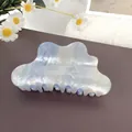 Elegant wave-shaped shark clip with pearlescent light blue and white flowy gradient finish - Light Blue
