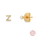 Detailed macro view of S925 sterling silver initial Z stud earrings with sparkling zircons - Letter Z / Gold
