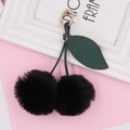 Portachiavi a ciliegia in peluche con due pompon neri e dettaglio foglia di pelle - Anello a Molla / Nero