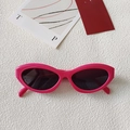 Stylish rose pink cat-eye sunglasses with dark lenses on a white textured background - Upturned Cat-Eye / Hot Pink(47)