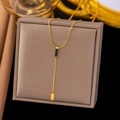 Golden Y-shaped snake chain necklace featuring a black geometric pendant and crystal tag - AH464 Y-lariat Black Pendant Gold