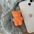 Cute matte orange bear-shaped collapsible socket phone grip on a white smartphone - Transparent Stand / Orange 3D Bear
