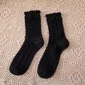 Chic black cable knit mid-calf socks with ruffle trim and wavy texture for women - Crew Socks / Black