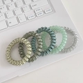 Set of 5 elastic spiral hair ties in grey and beige colors on a laptop keyboard - 1# Green Spiral (5pcs Set)