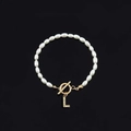 Fashionable faux pearl bracelet with gold letter L rhinestone pendant and OT clasp closure - Gold Letter L (SL2013)
