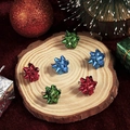 Three pairs of Christmas bow earrings in red, green, and blue on a festive wooden base - 3 Pairs/Set Christmas Snowflake Simple Women's Earrings