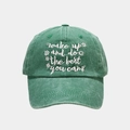 Detailed close-up of vintage washed green cotton baseball cap with white embroidery - Adjustable / Green