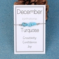 Irregular turquoise beads December birthstone bracelet on a white display card - December/Turquoise